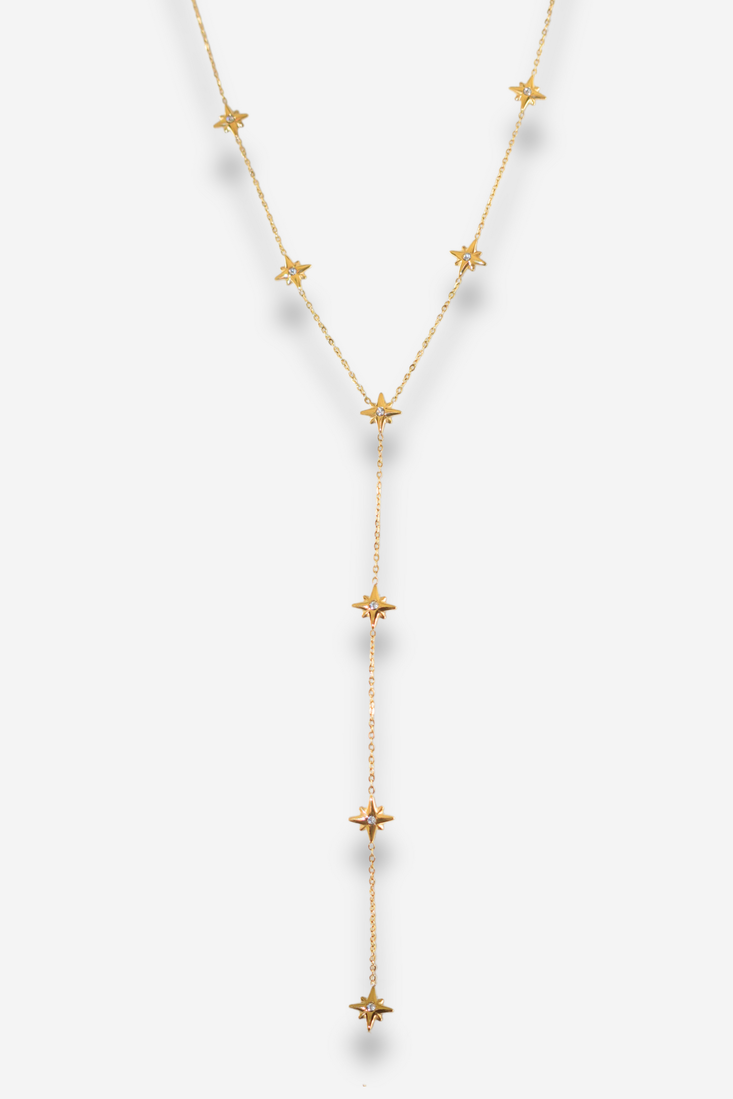 Collier en “Y” doré avec étoiles à strass de Sisters Bay, chaîne délicate avec pendentif étoile et chaînette ajustable. Résiste à l'eau et ne ternit pas.