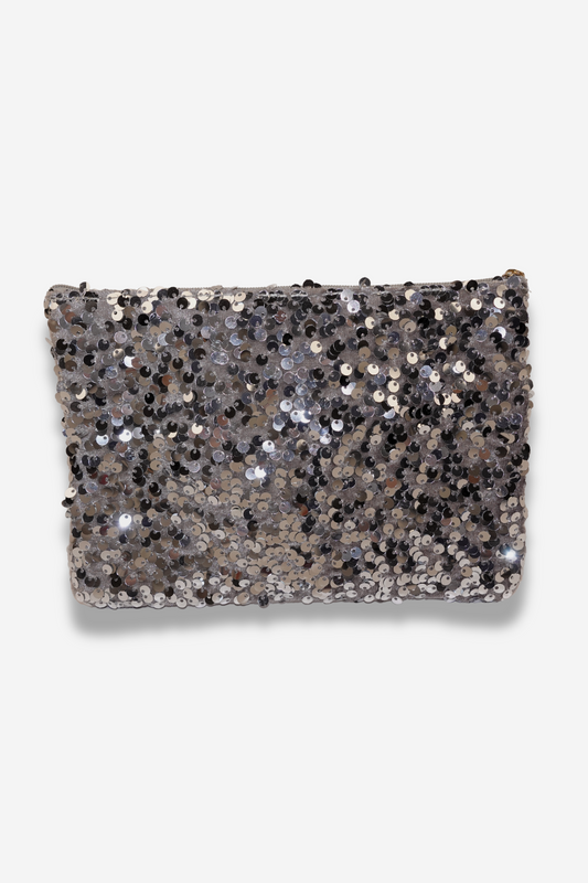 Pochette GLITTER en polyester argent avec grandes paillettes rondes et fermeture éclair dorée. Idéale pour maquillage ou objets personnels. Disponible sur Sisters Bay.